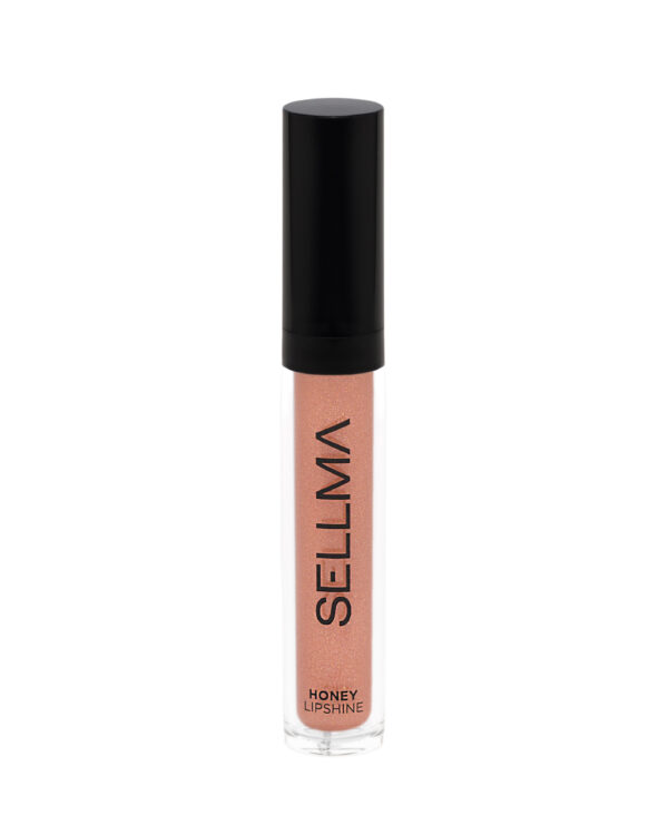 Lip gloss tube with a black cap, peachy-pink shimmer, labeled 'HONEY LIP SHINE' on the bottle