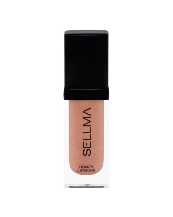Lip gloss/liquid lipstick tube with a black cap, showing a peachy, glittery shade and the words 'HONEY LIPSHINE' on the label bottom.