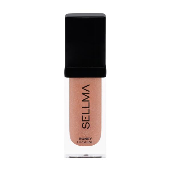 Peachy nude liquid lipstick in a clear tube with a black cap; vertical brand text on the side (Sellla). Sheer/sparkly finish suggested by the shade.